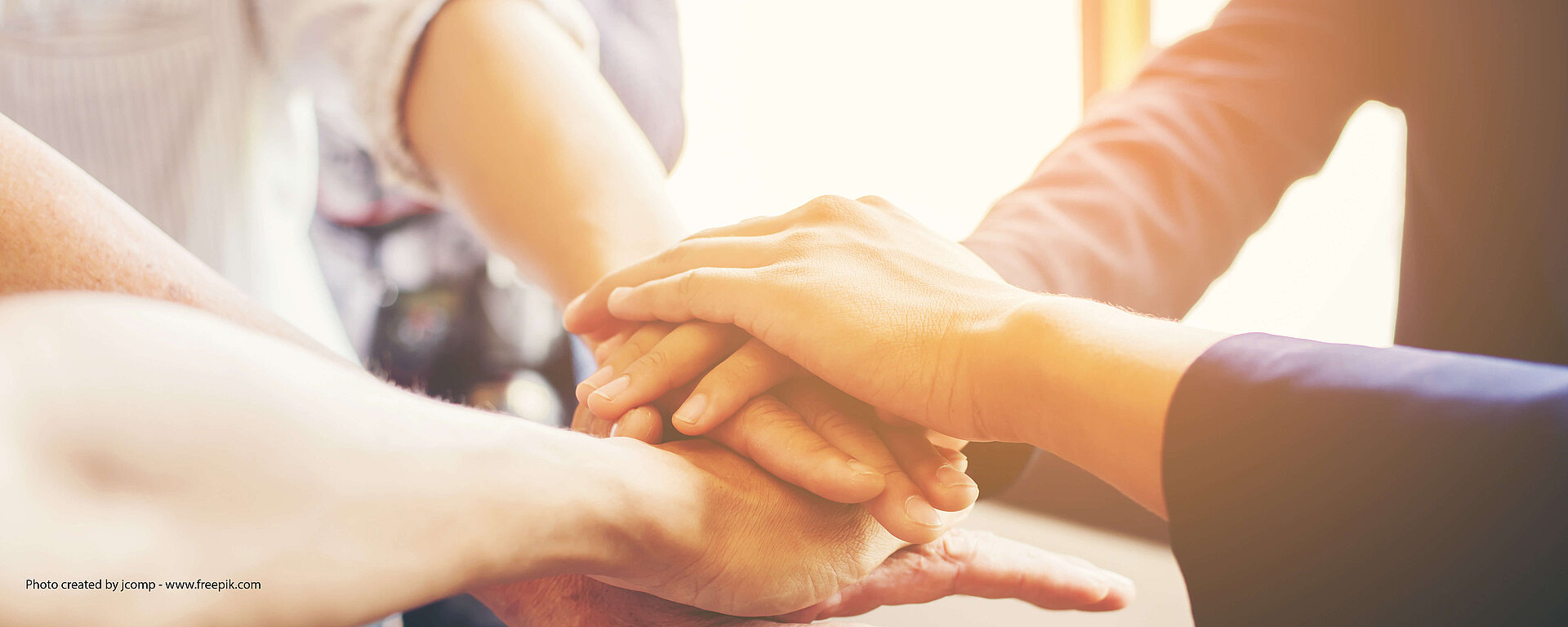 Hände aufeinander - Team symbol